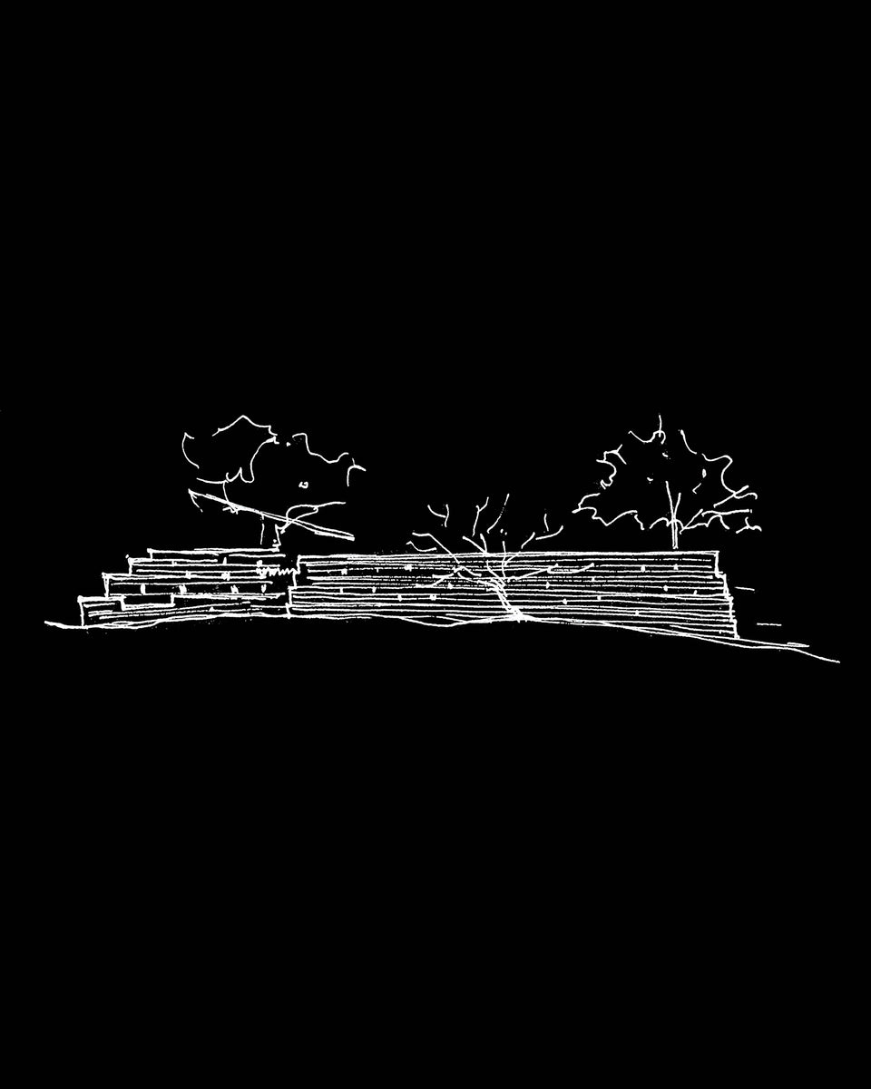 Sketch of stacked brick courses reading as a kiln, with trees rising above the mass