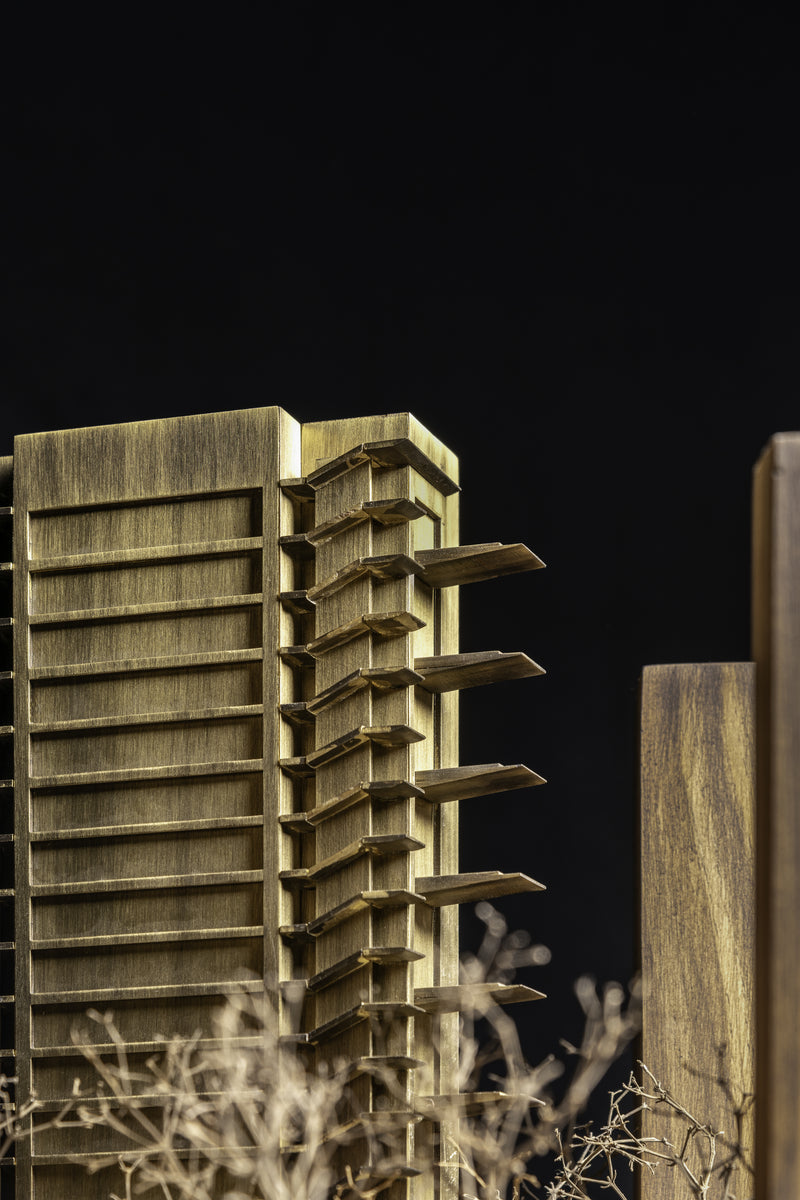 Model detail in brass showing terrace fins projecting on alternating floors