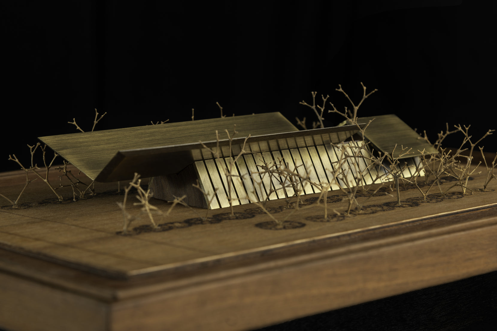 Scale model in brass showing the folded roof over the ribbed glass body