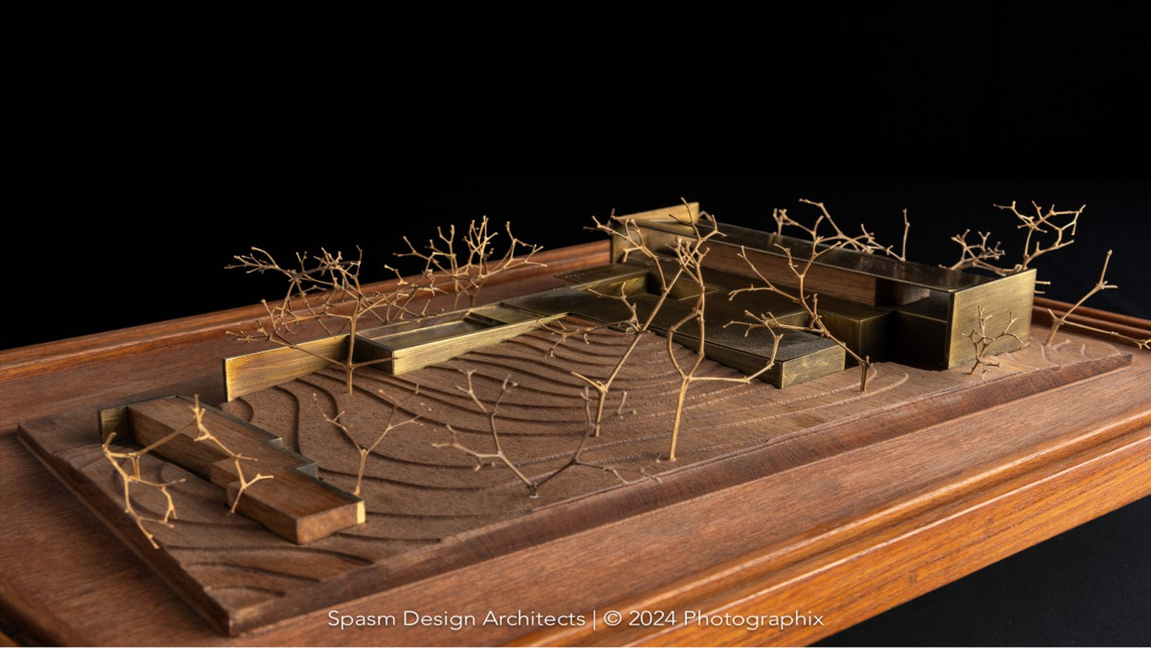 Scale model of Gomati on a timber base, brass volumes among wire trees and modelled contours