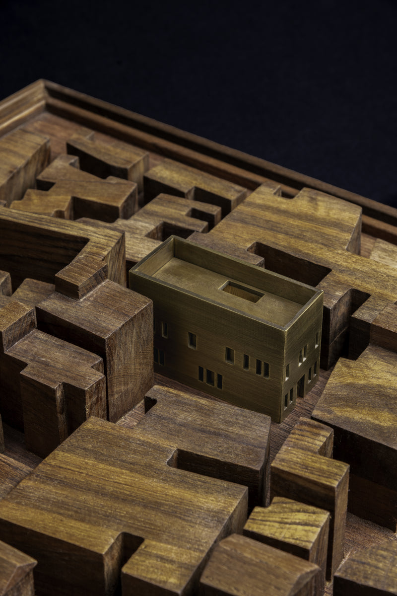 Close-up of the study model, the brass house with its open roof court hemmed by dense blocks