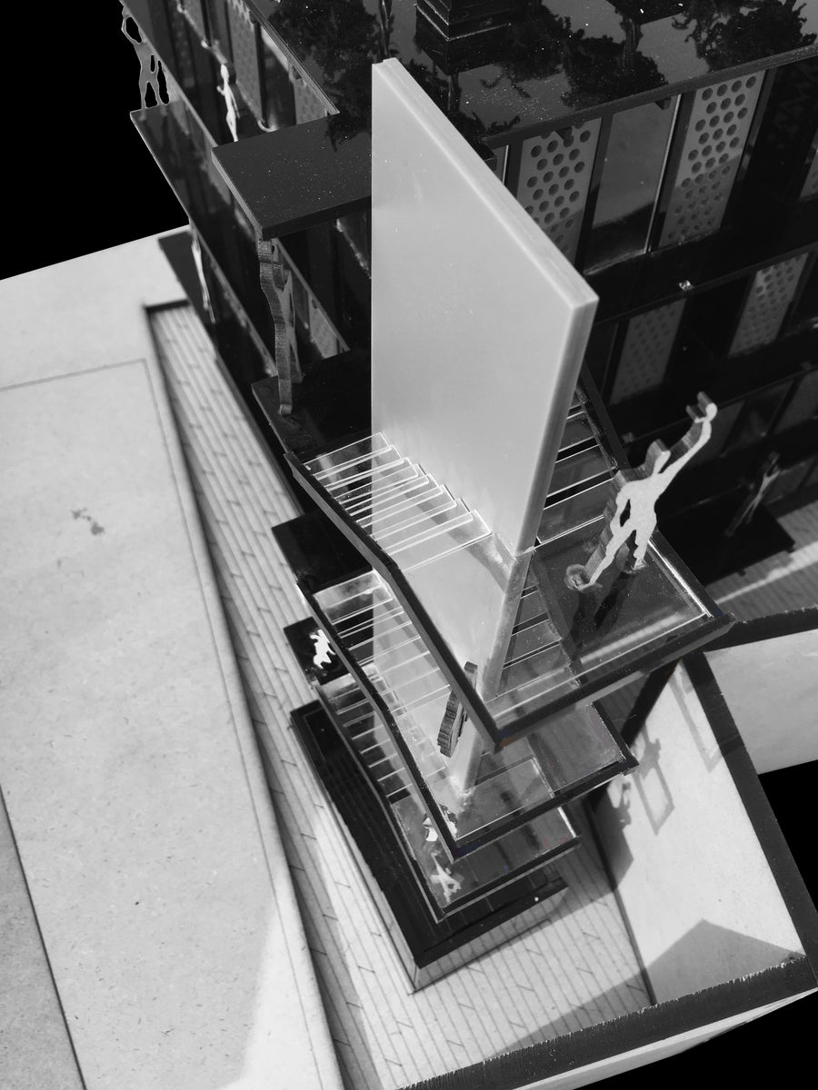 Black-and-white study model looking down onto the stair and a white blade wall