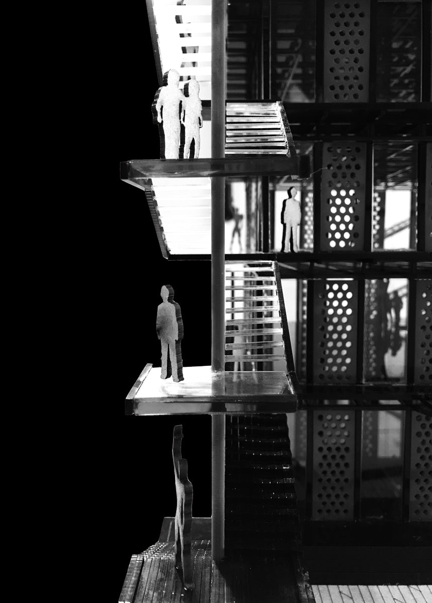 Study model in close detail, cut-out figures standing on the cantilevered landings