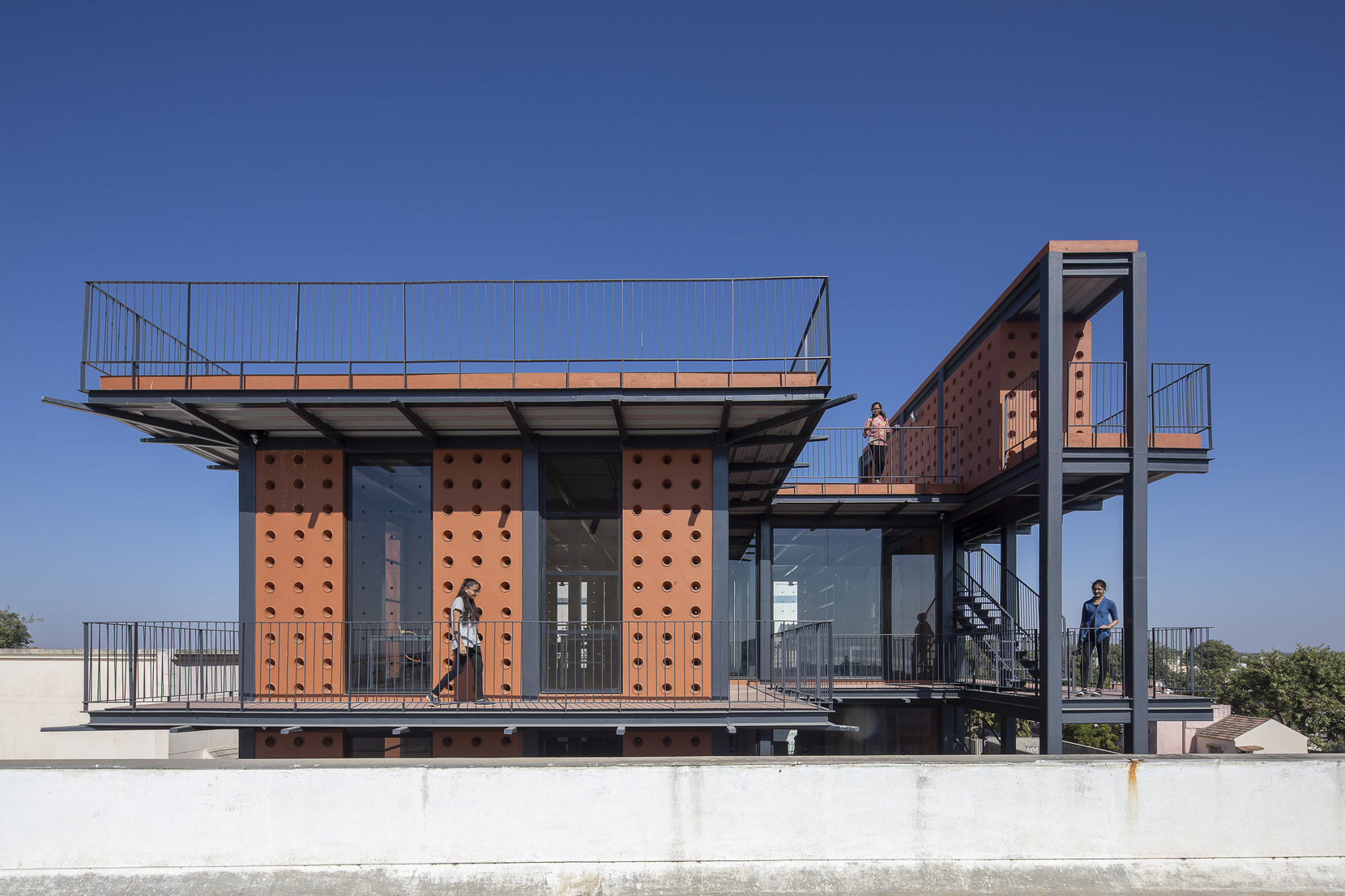 Mandvi Science Laboratory in Kutch, its terracotta panelled block carried on a black steel frame