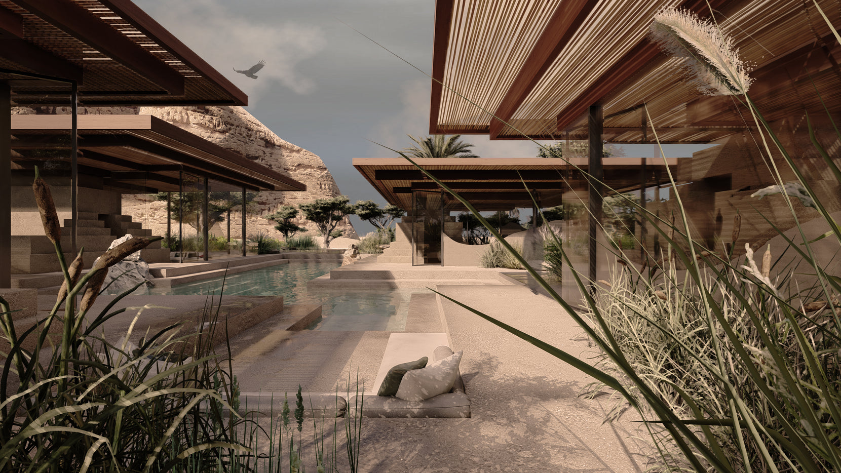 Reed grasses framing the water court, slatted timber canopies cantilevered over adobe terraces