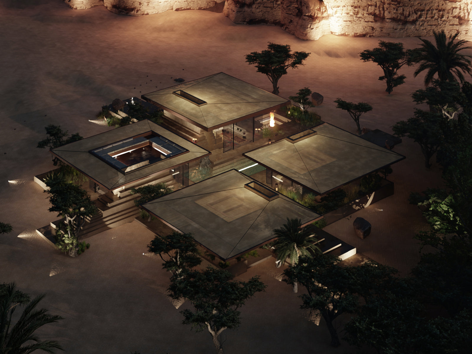 Night aerial with the four roofs lit from within and a courtyard pool at the centre