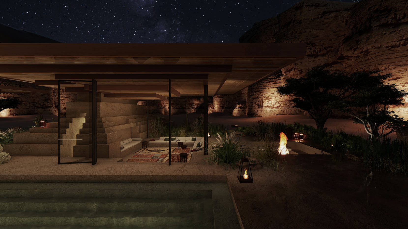 Open living pavilion under a starlit sky, a fire burning beside the terrace and cliffs behind