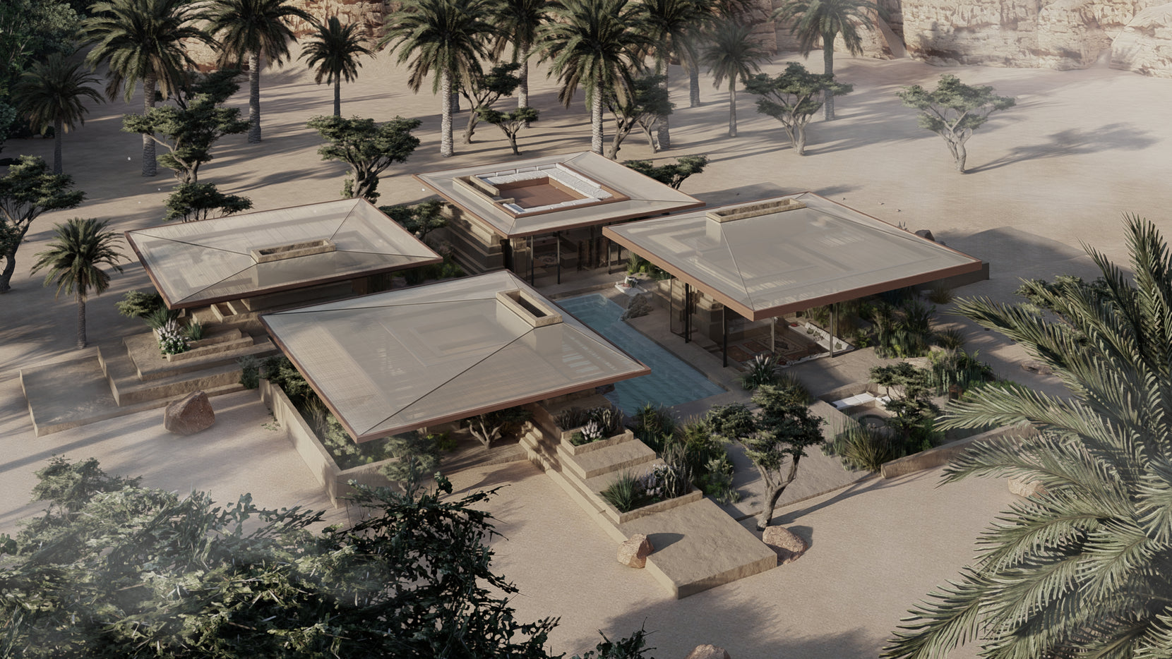 Aerial of Mastaba Maskan, four flat-roofed pavilions pinwheeling around a court amid date palms