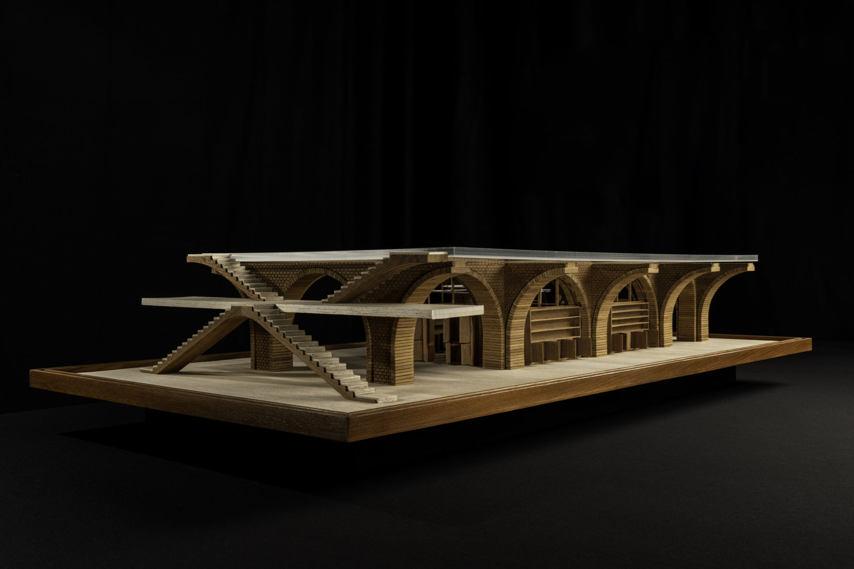 Model of the arcaded block on its timber base, external stairs stepping down at one end